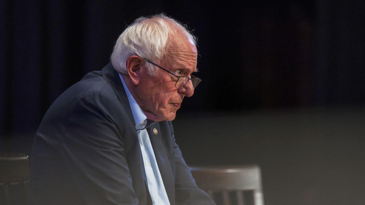 Bernie Sanders sitting during an event.