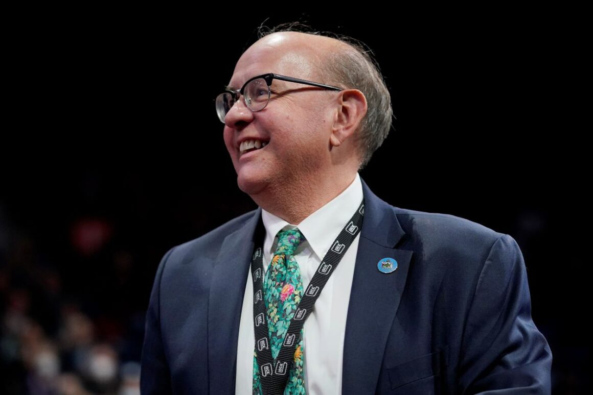 Matt Dunlap smiles while looking off in the distance.