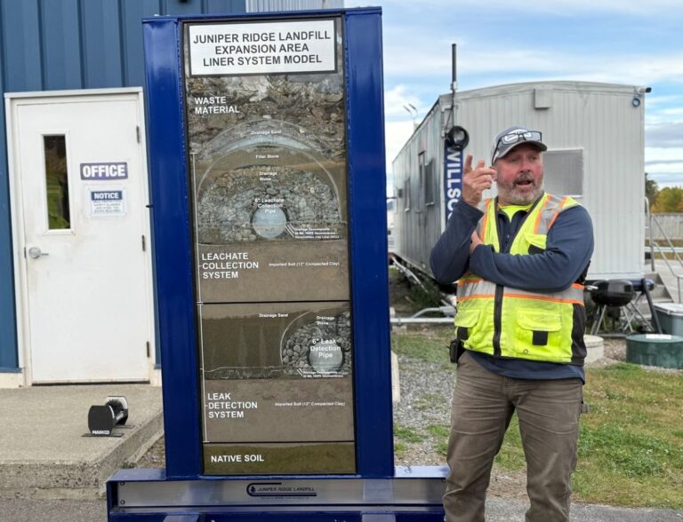 Paul Monroe speaking to a reporter.