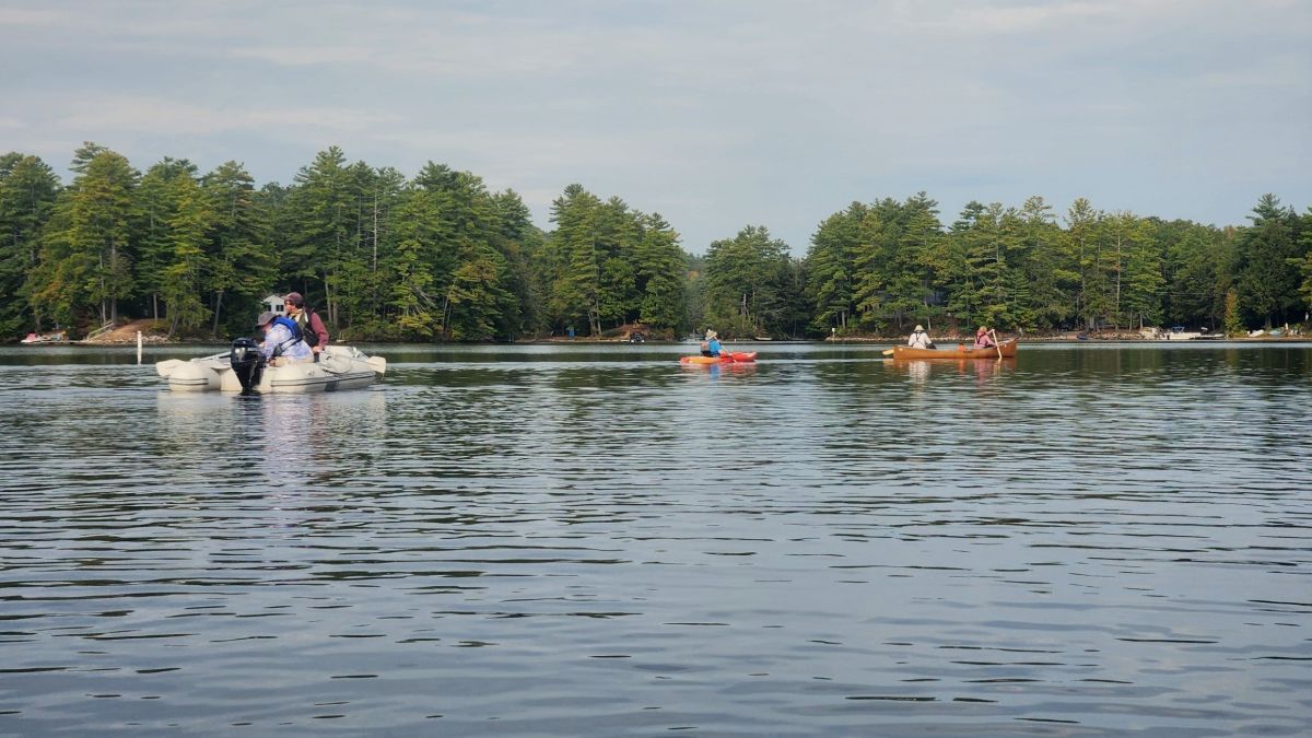 surveyors in boats checking the lake.