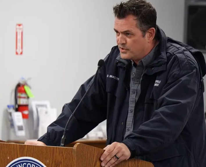 Daniel Bradstreet speaks during a meeting.