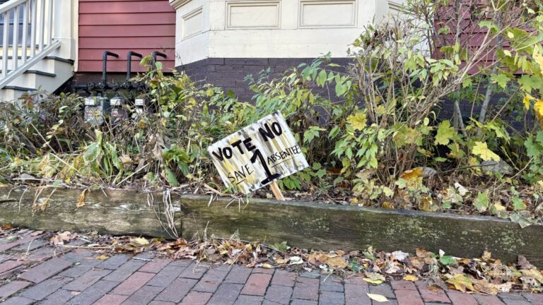 a sign urging voters to vote no on Question 1.