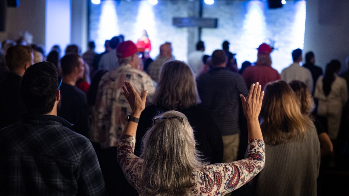 attendees singing at an event.