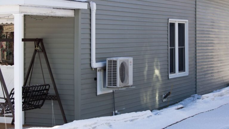 heat pump on the side of a house.