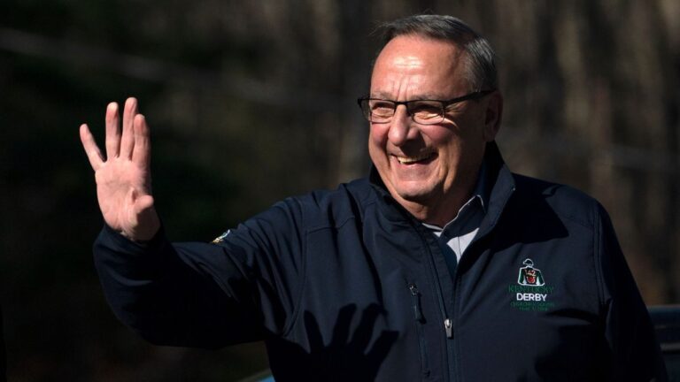 Paul LePage waves to supporters.