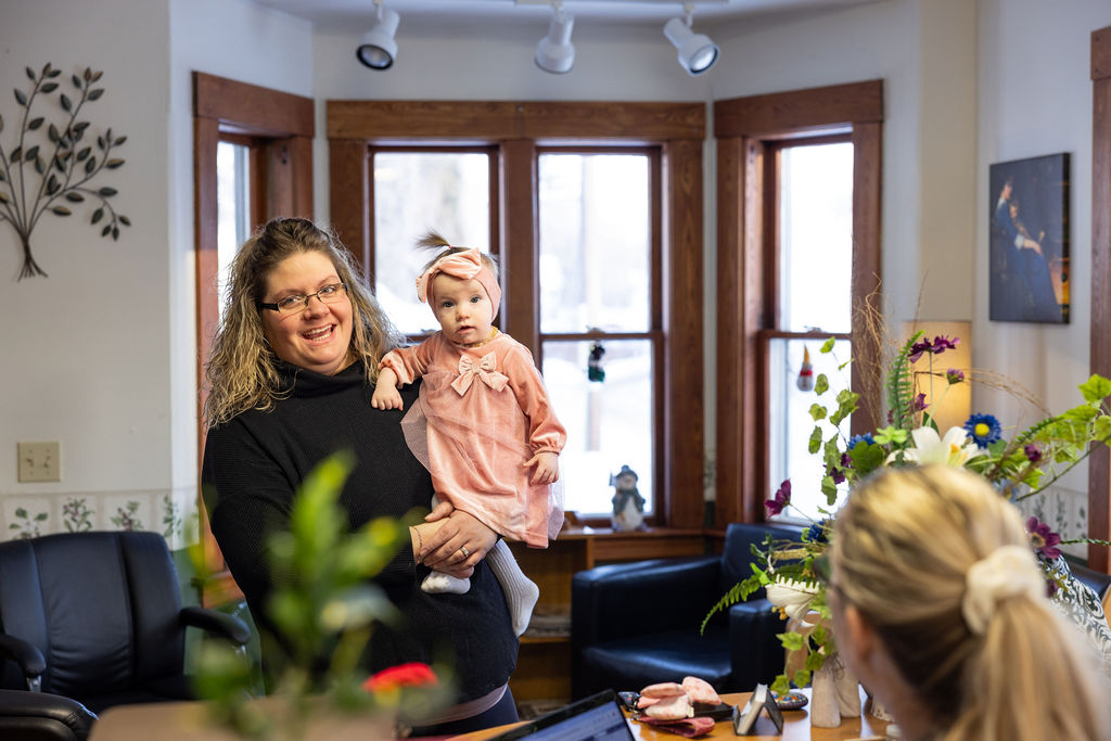 woman holding her young daughter