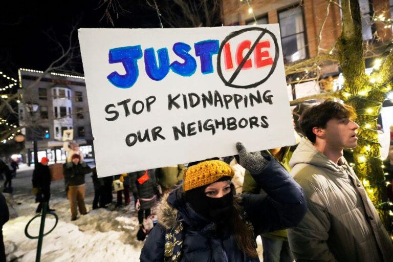 a sign that reads stop kidnapping our neighbors.