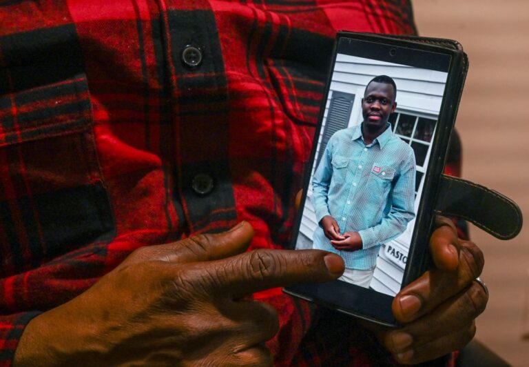 a picture of Evaristo Kalonji seen on a cellphone.