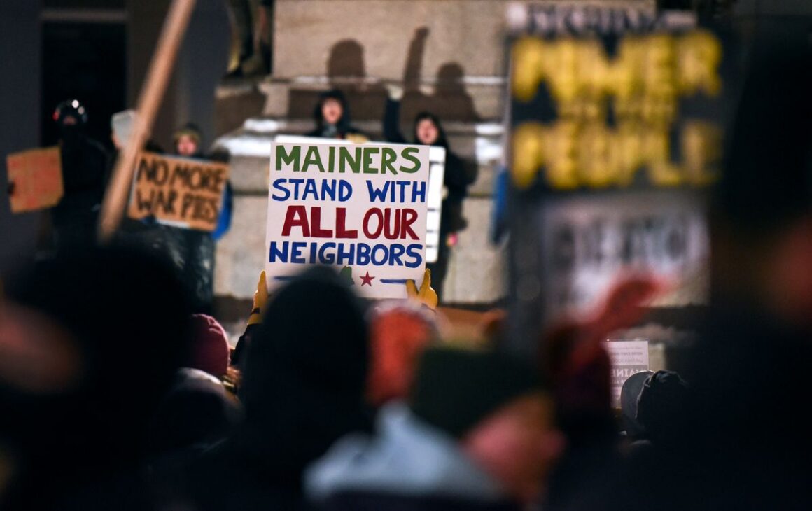 a sign that reads mainers stand with all our neighbors.