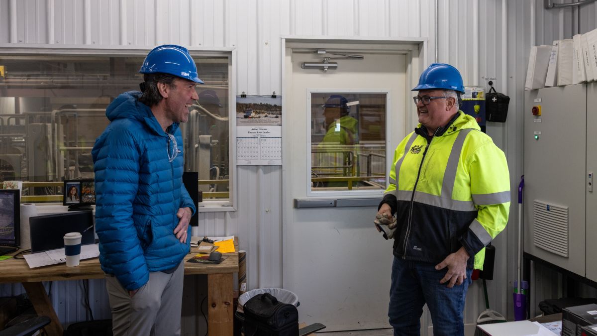Chris Brochu and Jason Brochu laugh during a conversation.