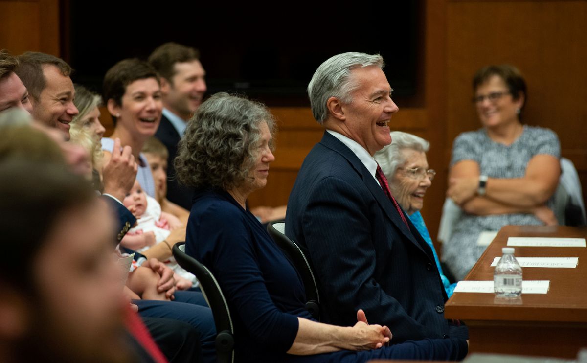 John A. Woodcock Jr. laughing.