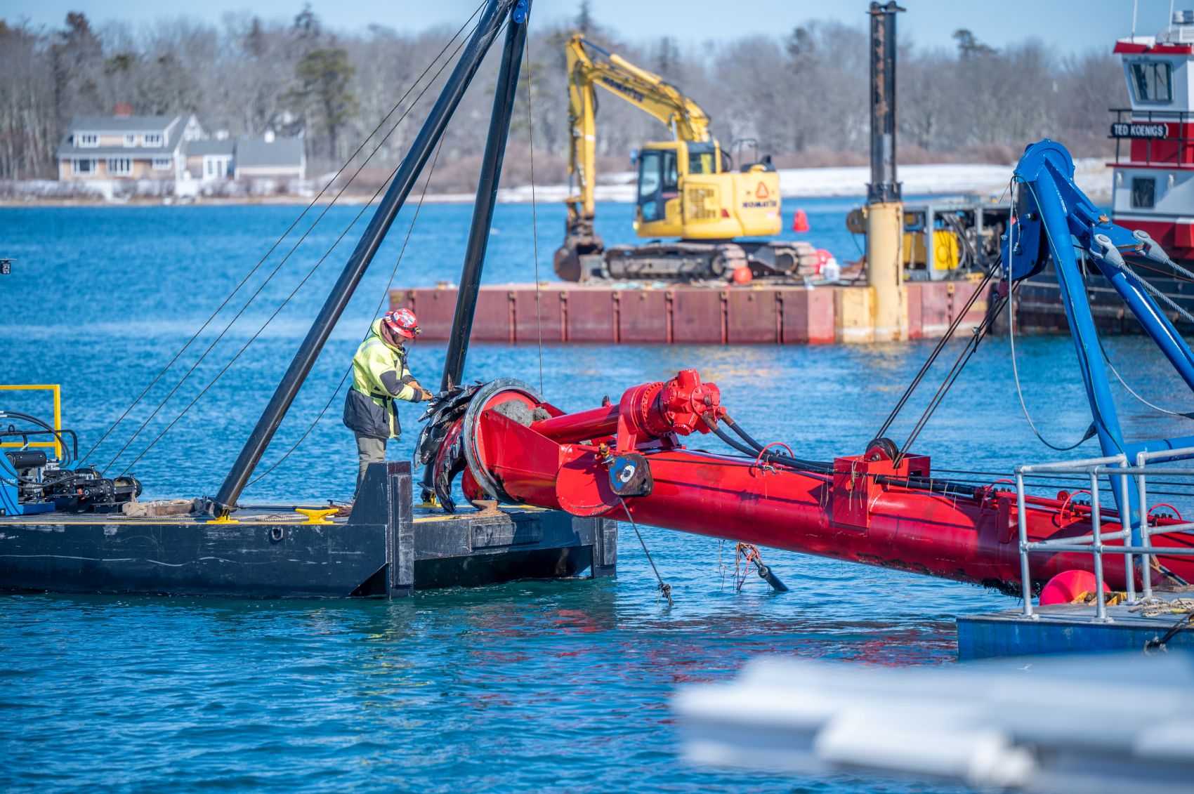closeup of a worker operating the dredge