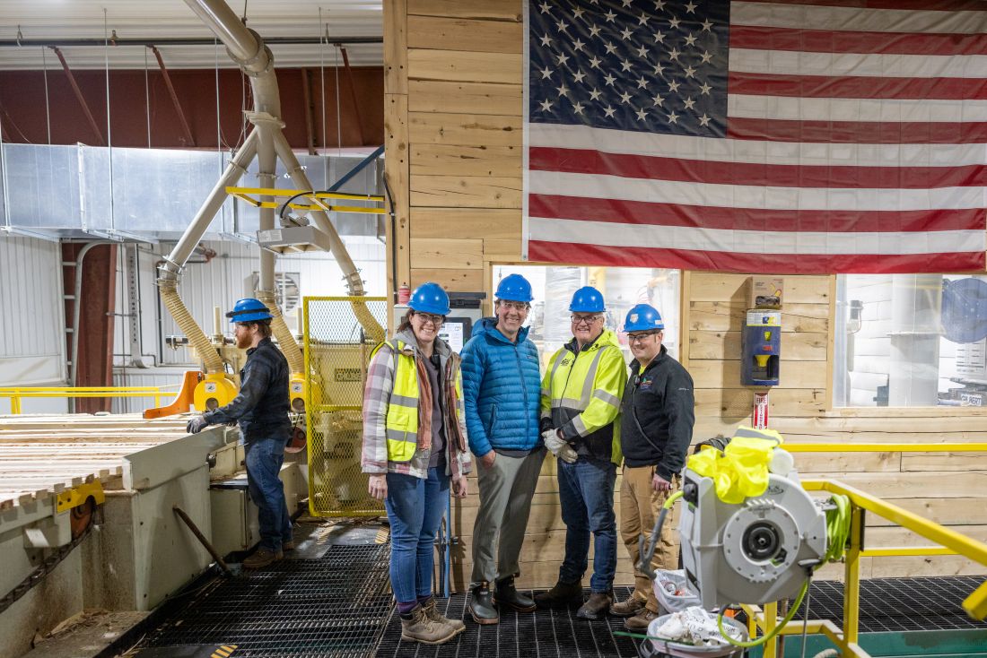 a group of workers pose for a photo