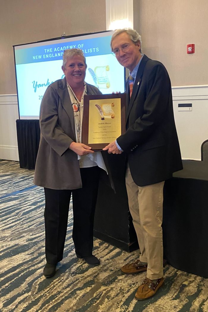 Judith Meyer receiving the Yankee Quill award.