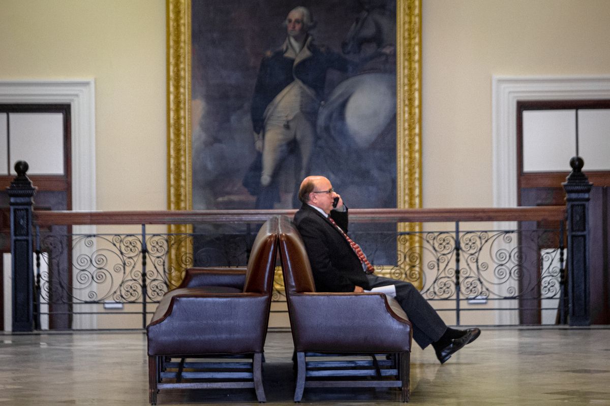 Matt Dunlap sits down while talking on the phone.