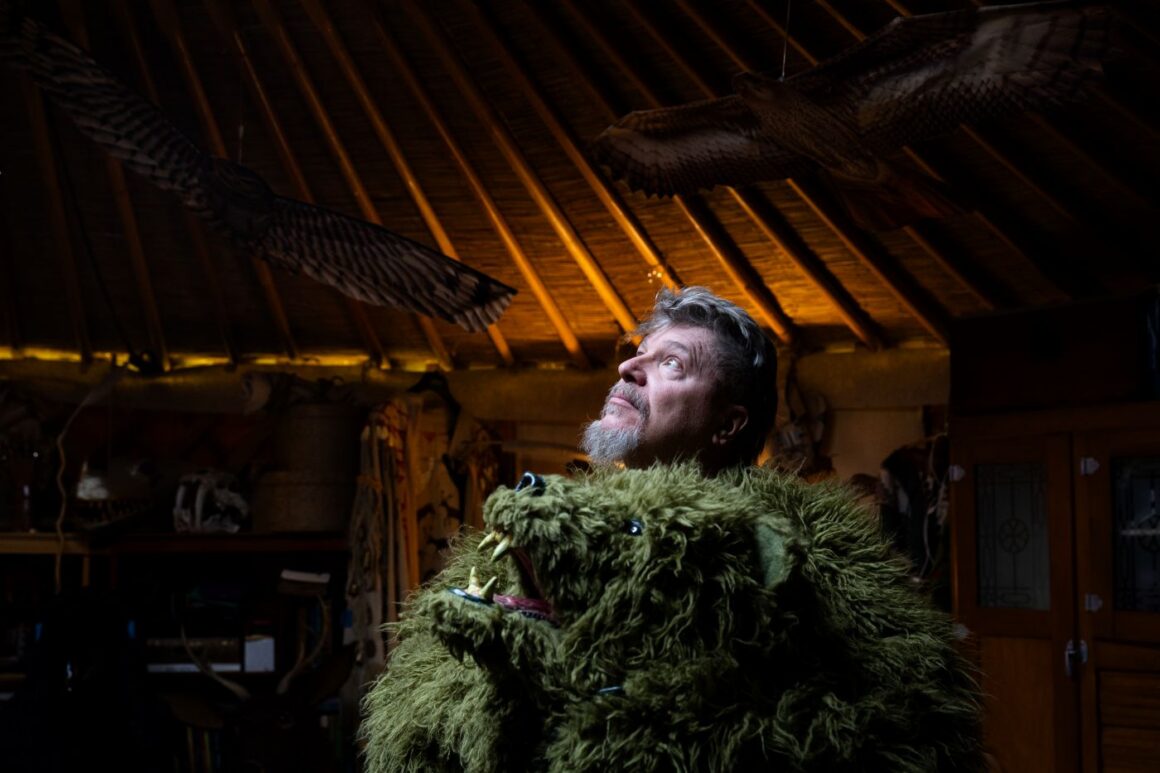 Paul Ridlon looks to the ceiling in his yurt.