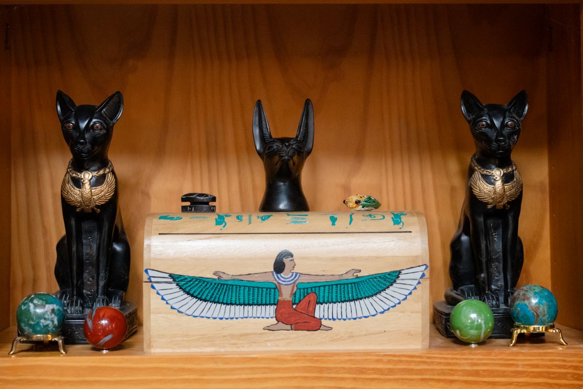 a shelf with statues of animals.
