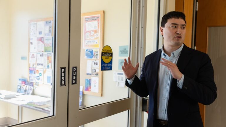 Zach Schwartz standing by an entrance to the building.