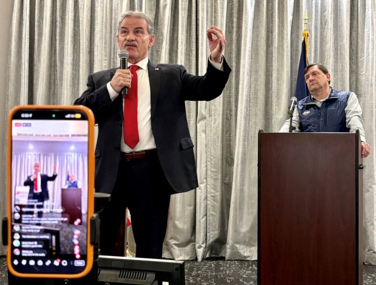 Bobby Charles speaks while Troy Jackson looks on.