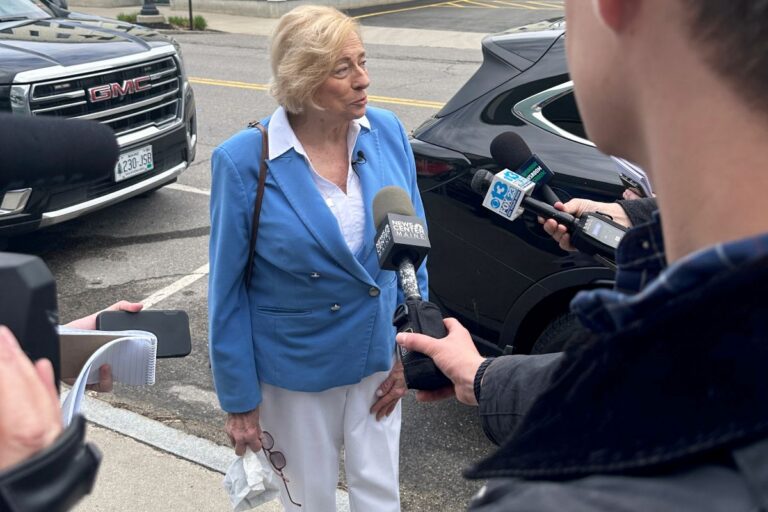 Janet Mills speaking with reporters.