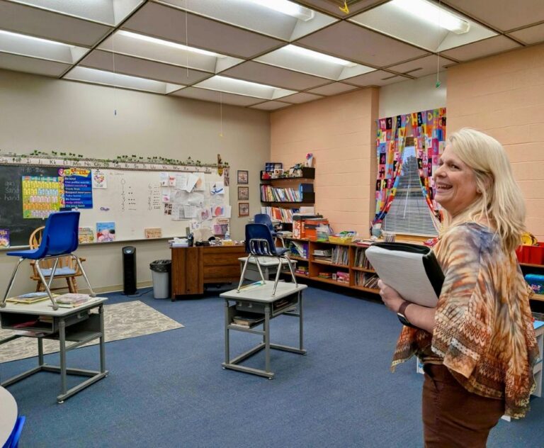 Paula Johnson stands inside her classroom.