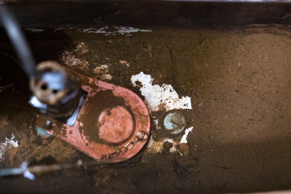 sludge inside the tank of a toilet