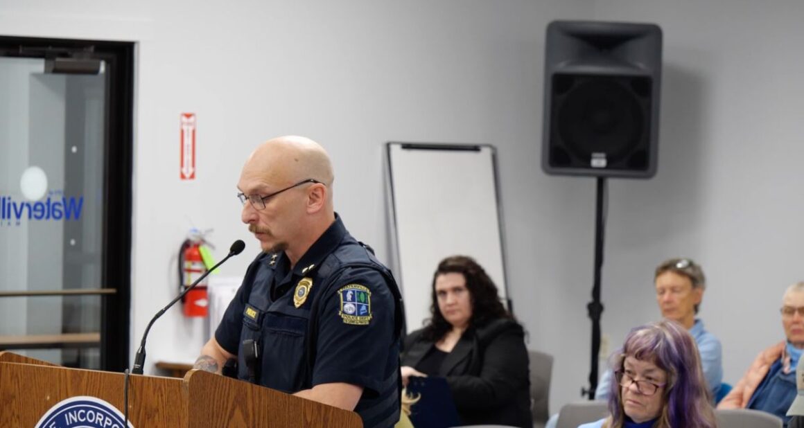 William Bonney speaks while standing at a podium.