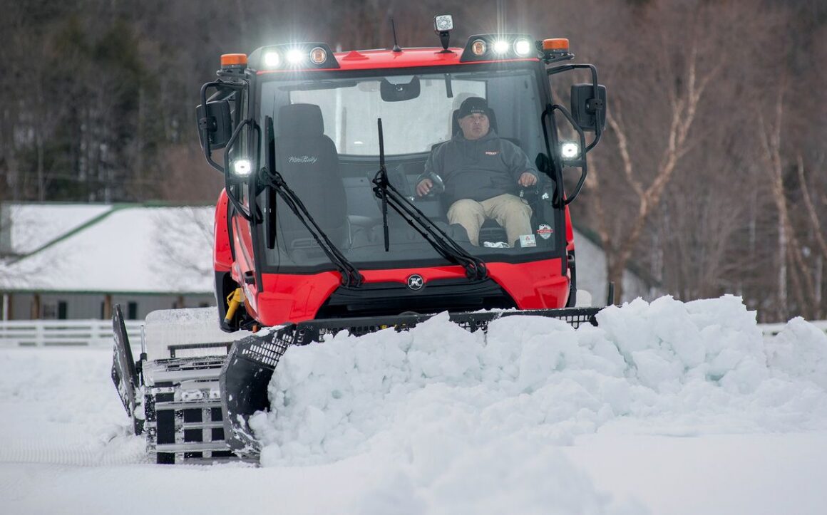 man plowing snow