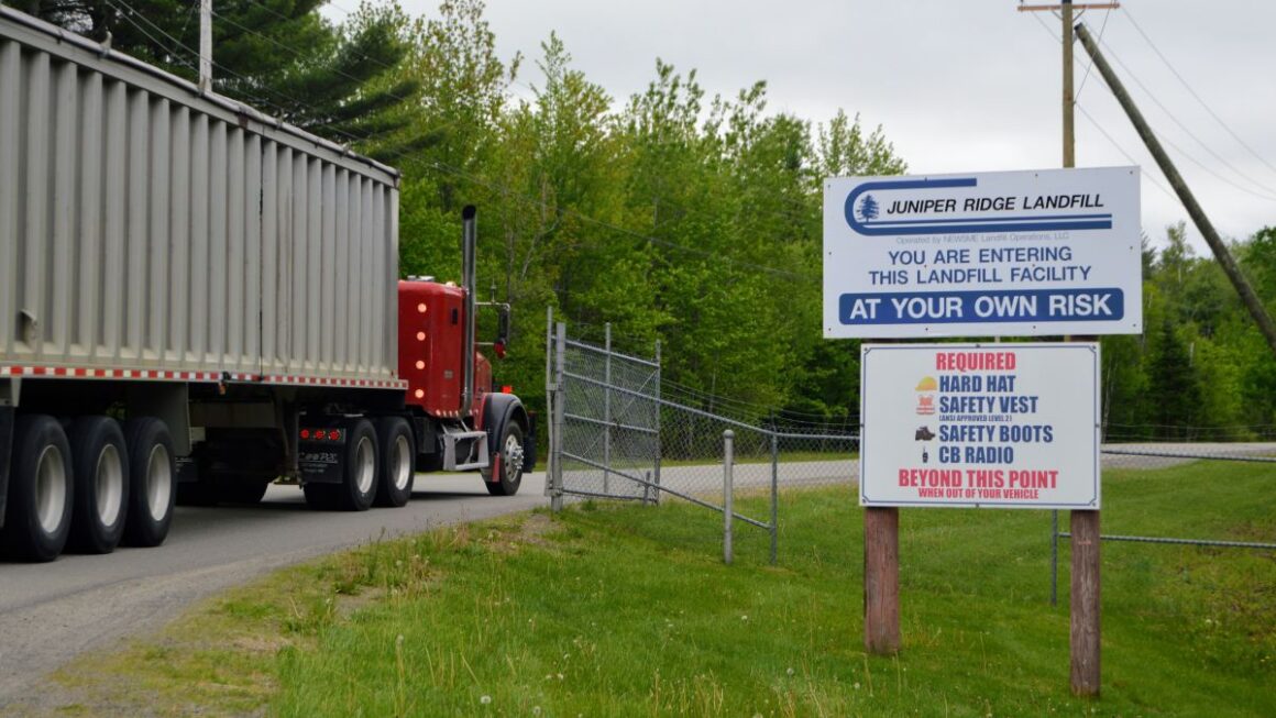 truck enters the gate at the Juniper landfill entrance.