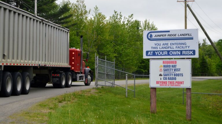 truck enters the gate at the Juniper landfill entrance.