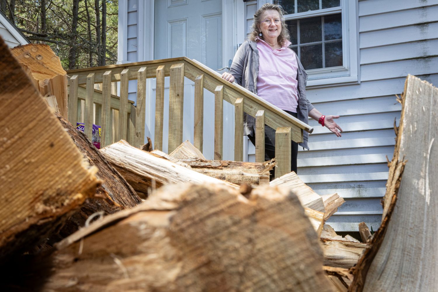 Lisa Austin poses for a photo next to her porch railing.