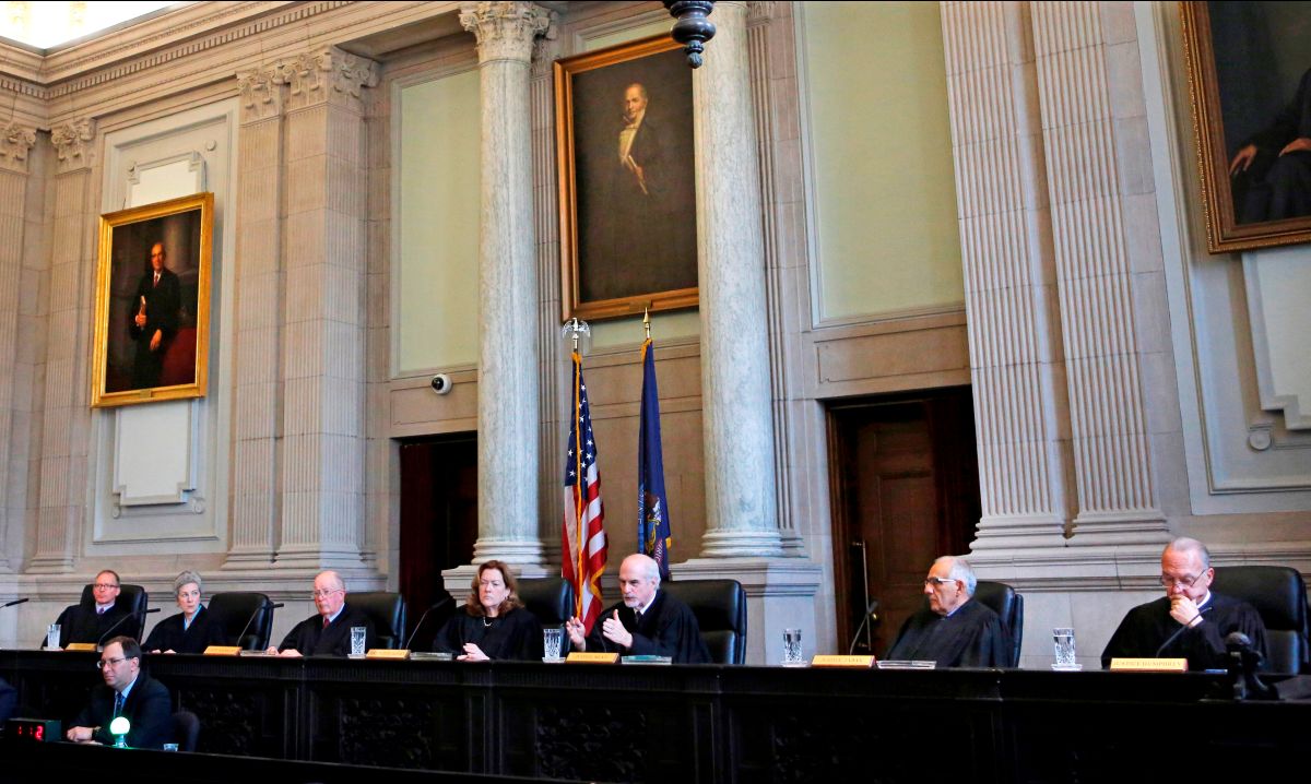 justices sit during a court hearing.
