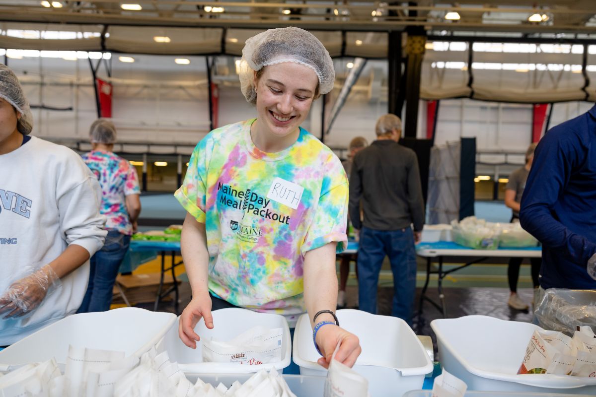Ruth Griffith packing meals among other volunteers.
