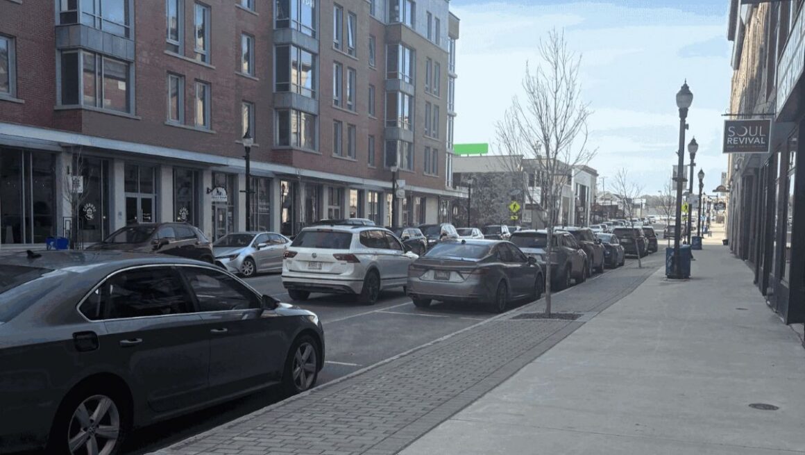 buildings line both sides of a street in downtown waterville.