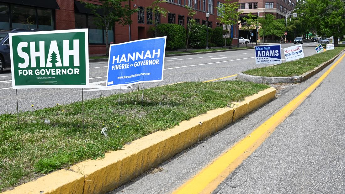campaign signs for several candidates, including Dr. Nirav Shah and Hannah Pingree, are seen in a median divider.