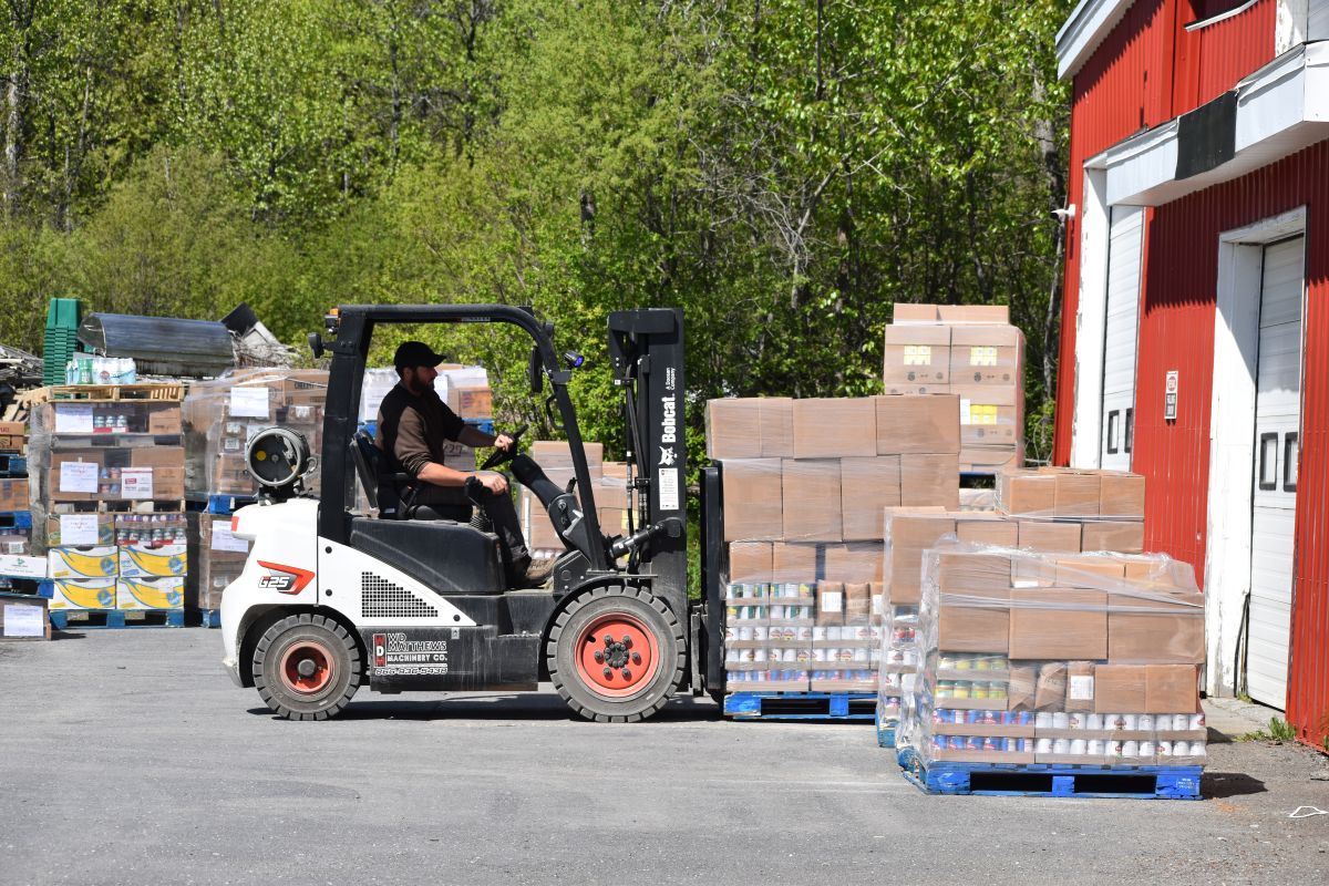 pallets of boxes being transported by forklift