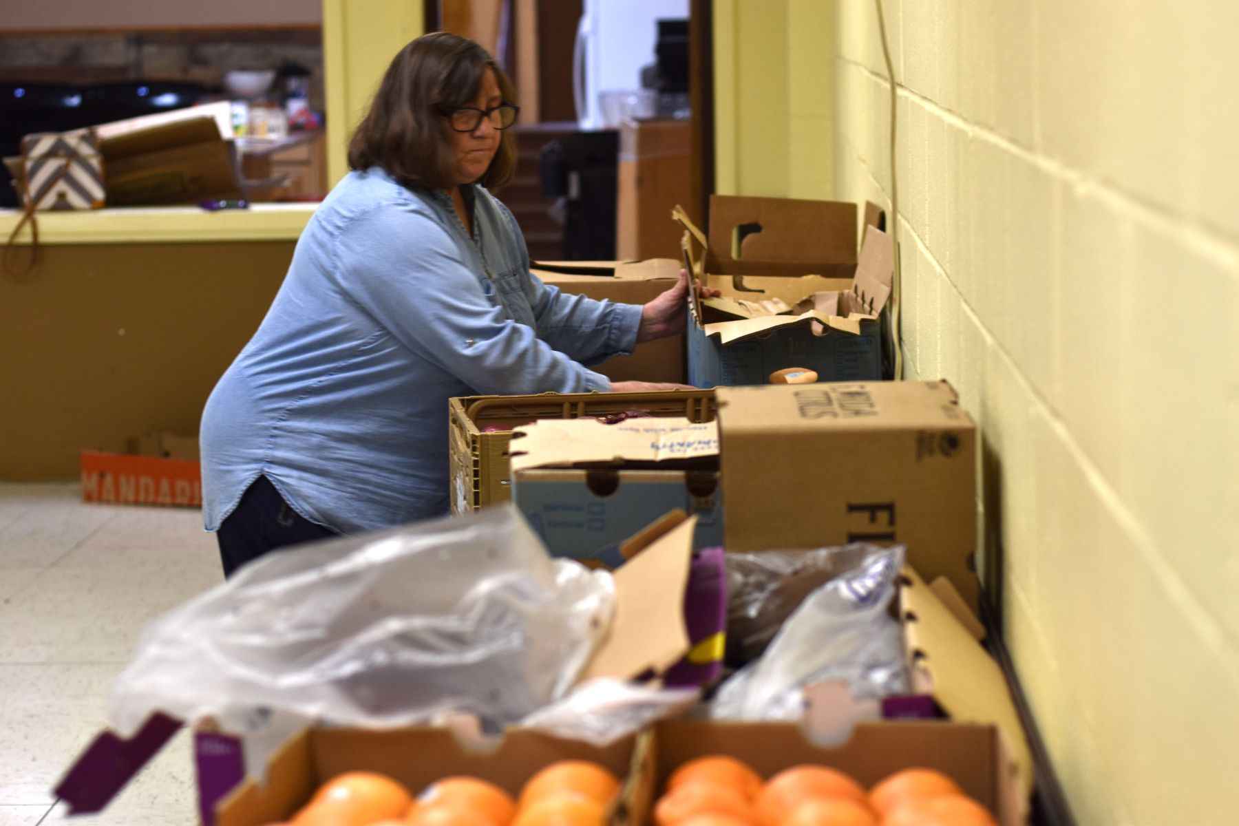 A volunteer fills a box