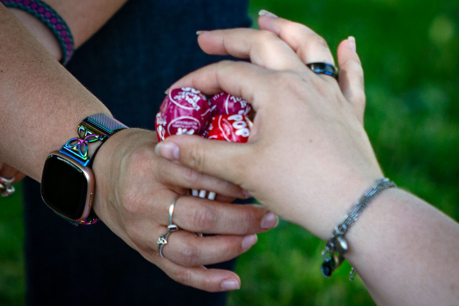 a hand choosing their desired lollipop flavor