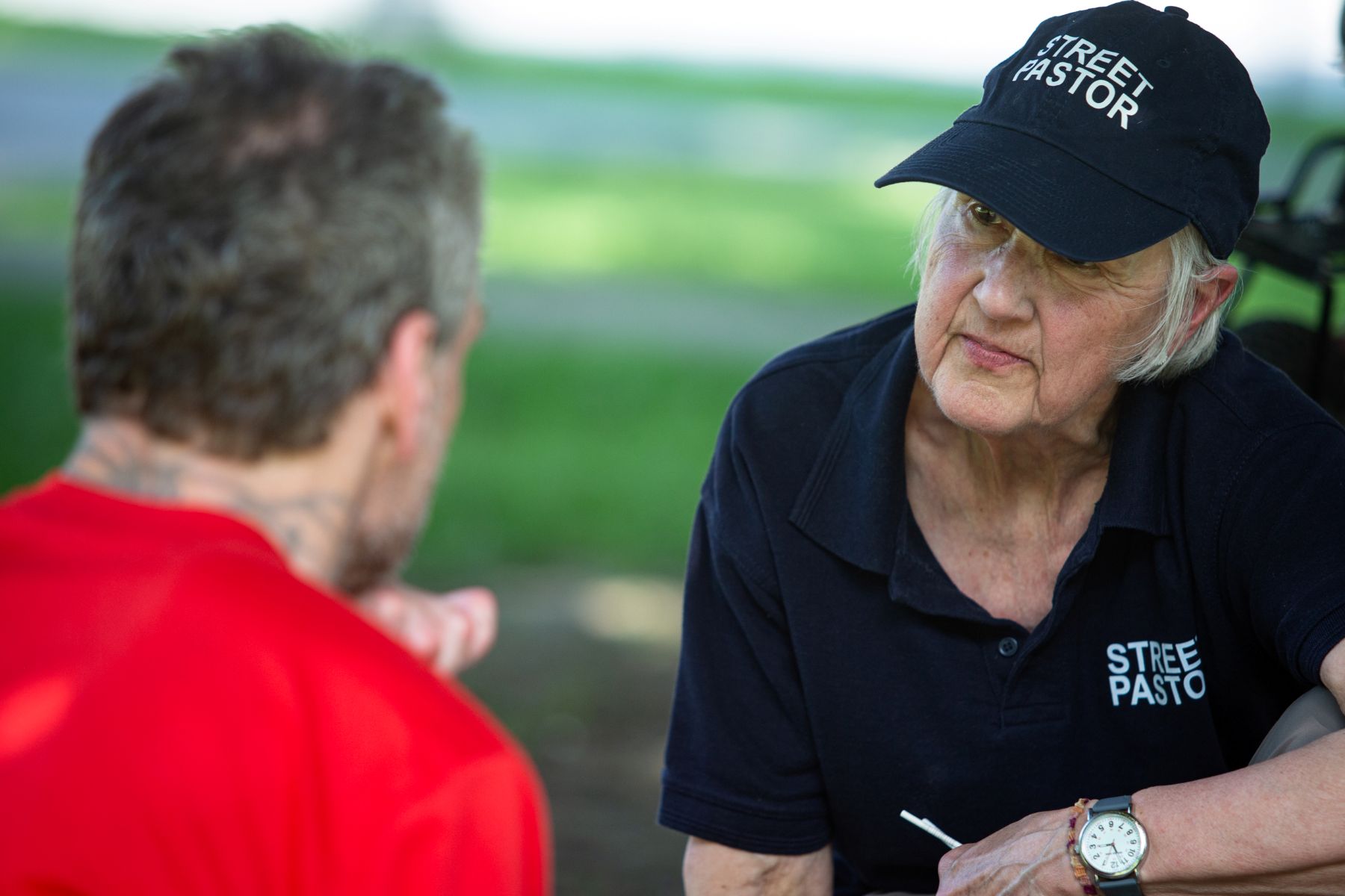 a volunteer listens to a person speaking.