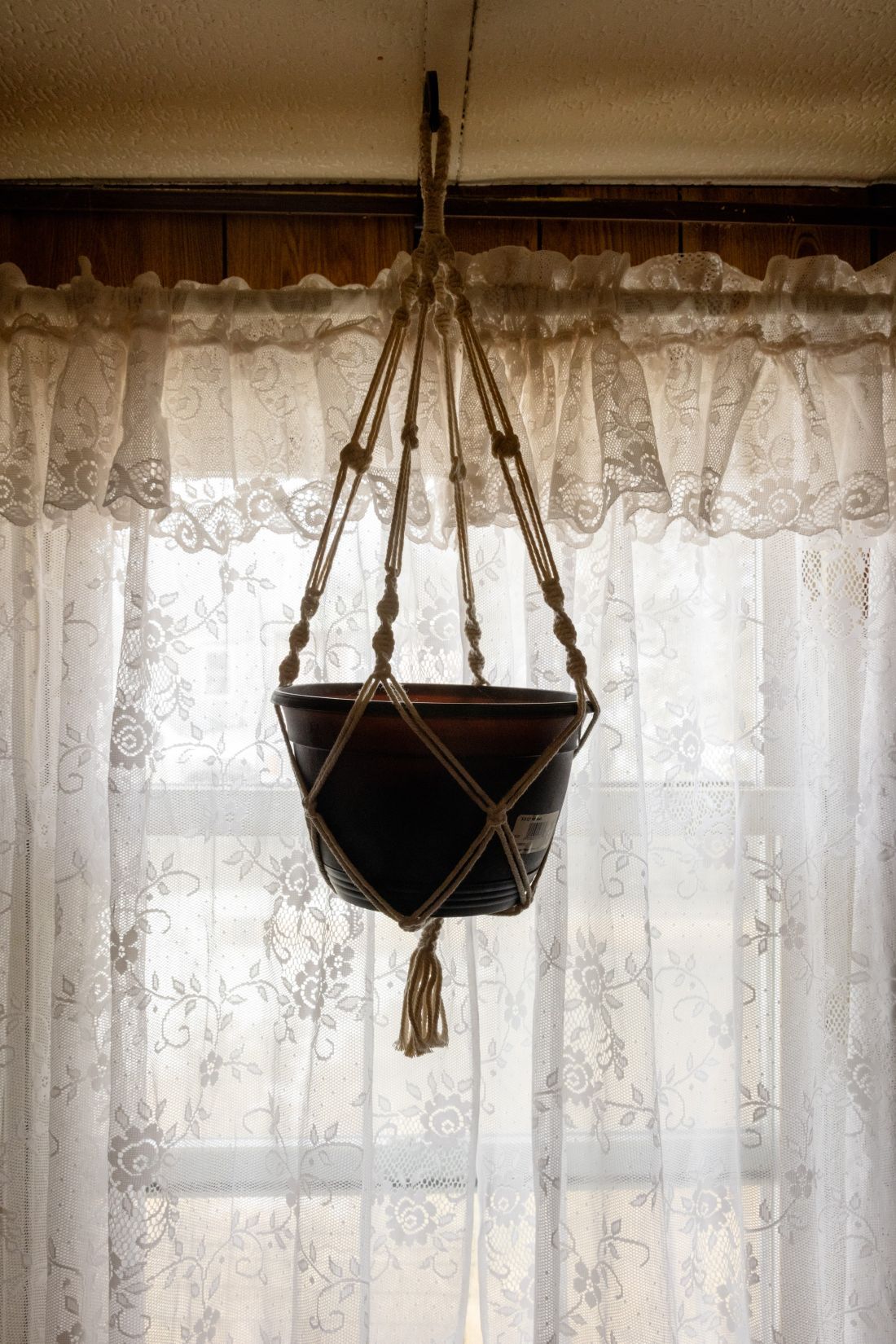a pot hanging from a ceiling.