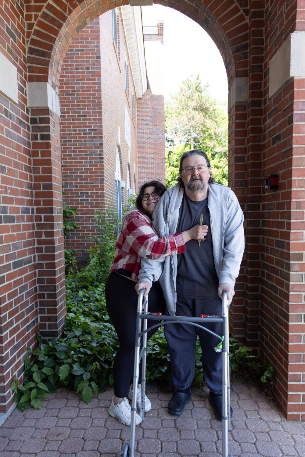 Christiana happily embraces her father.