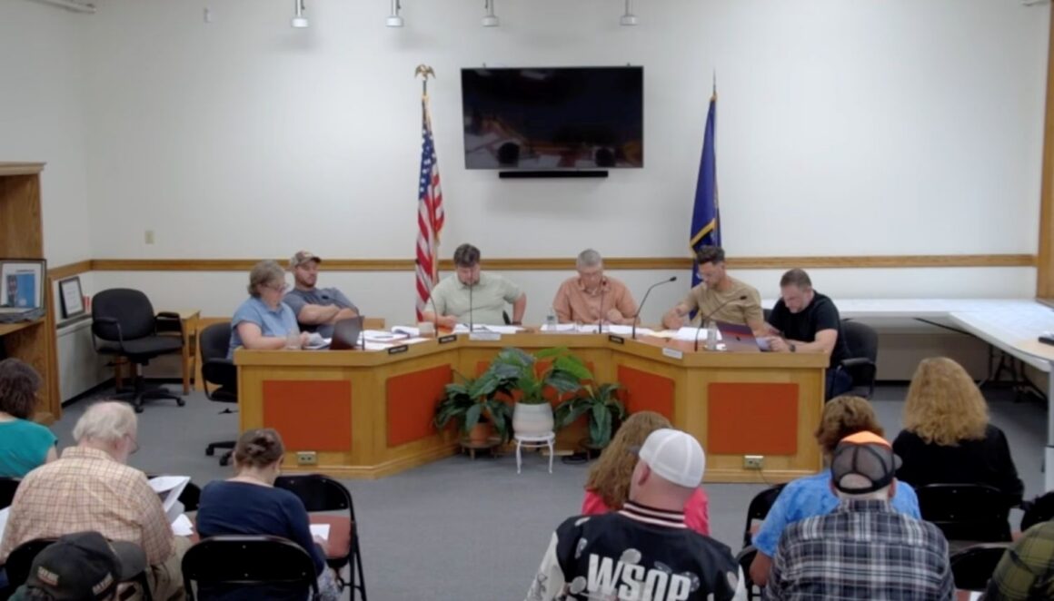 members of the select board during a meeting.