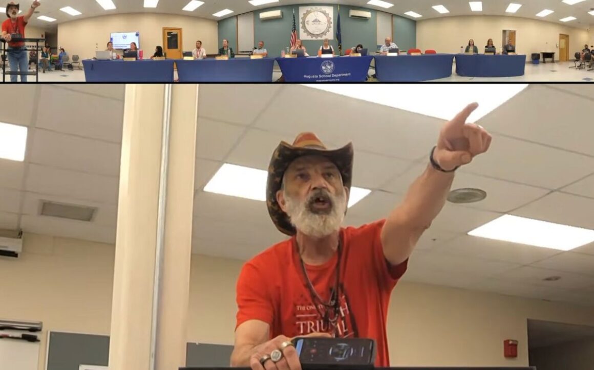 Tim Bodnar points while speaking during a meeting.