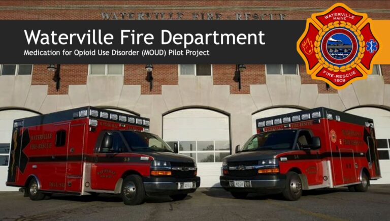 a slide presentation featuring two ambulances. The text states Waterville Fire Department Medication for Opioid Use Disorder Pilot Project.