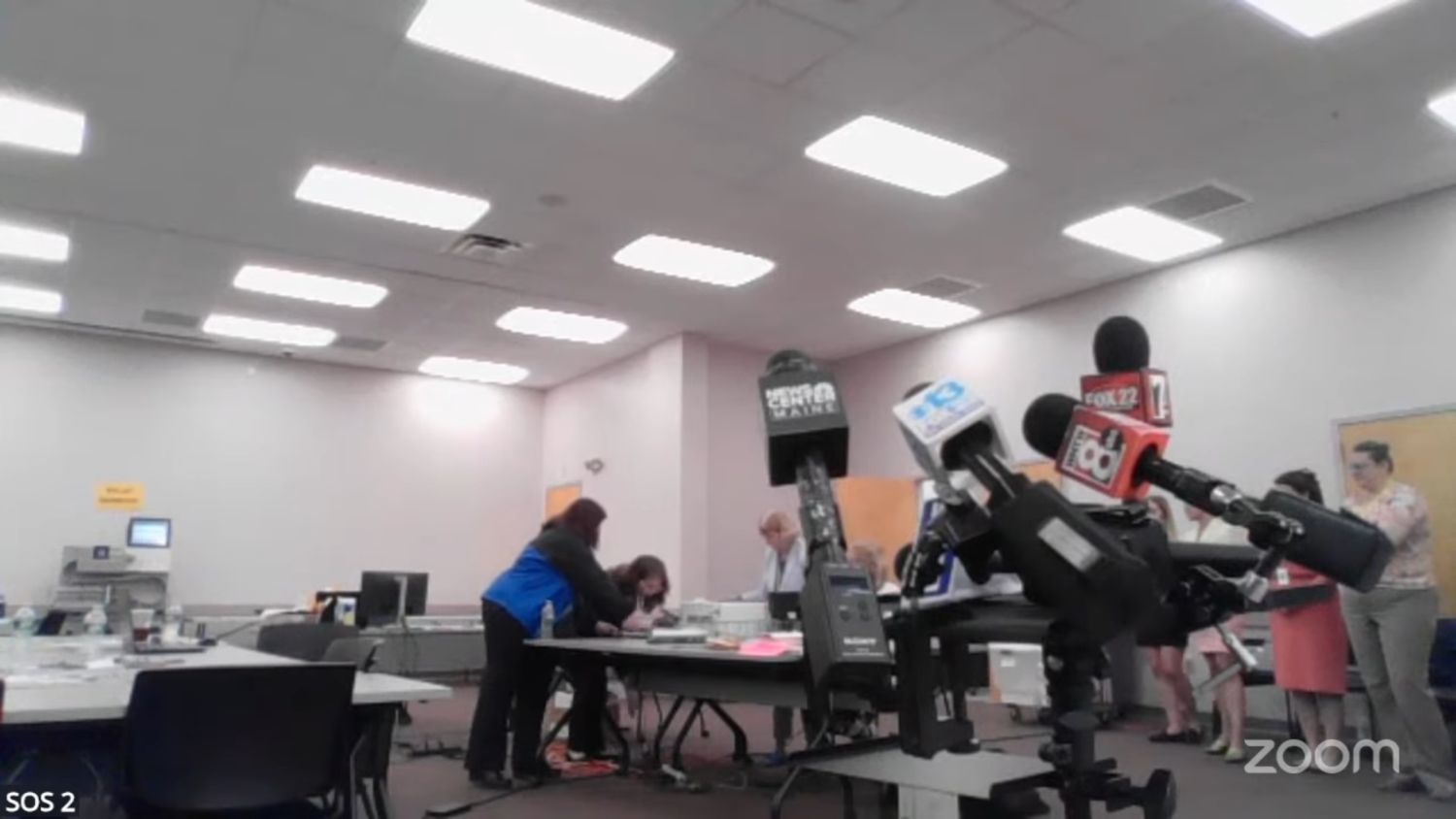 officials work to fix a printer issue