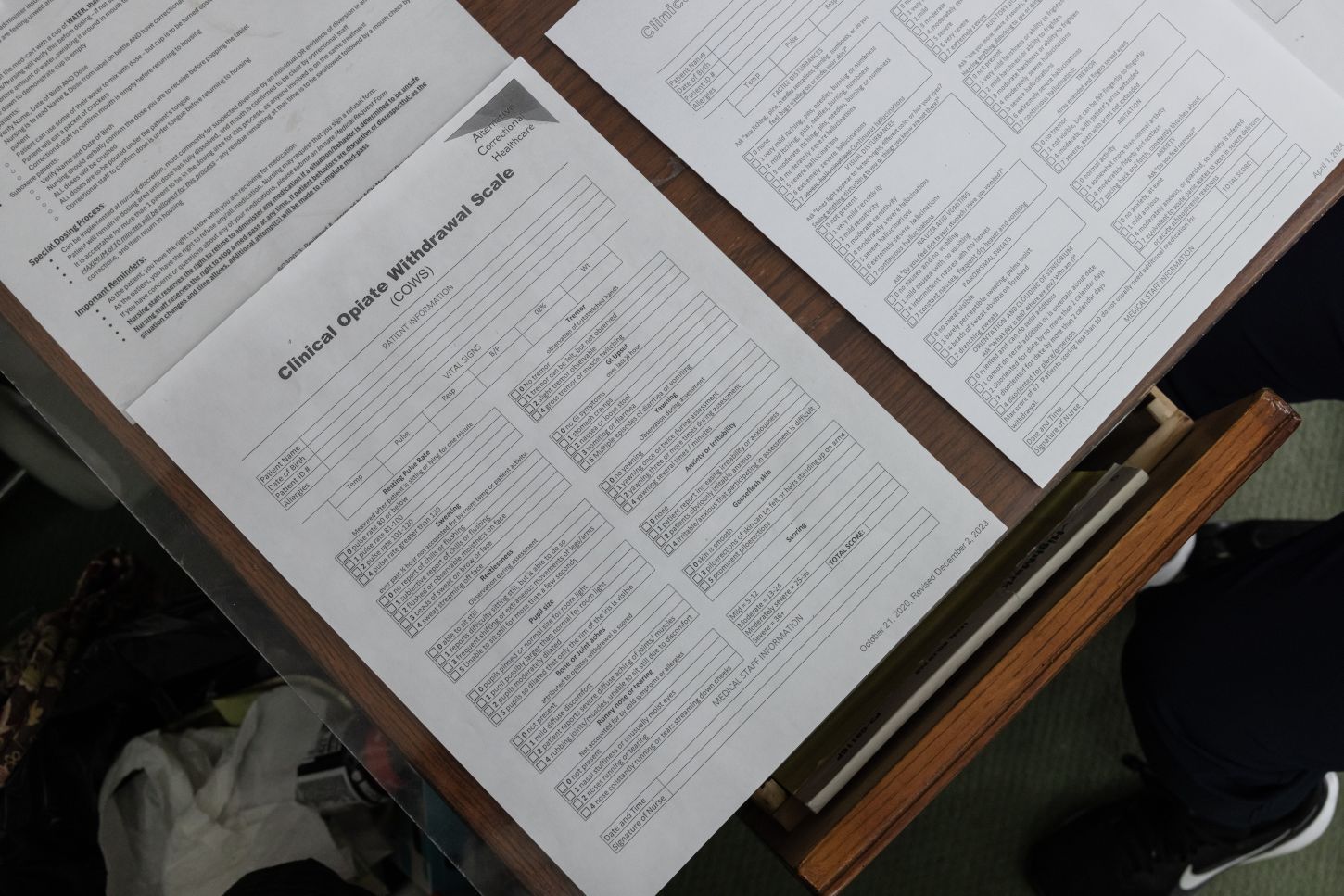 a series of paper forms on a table