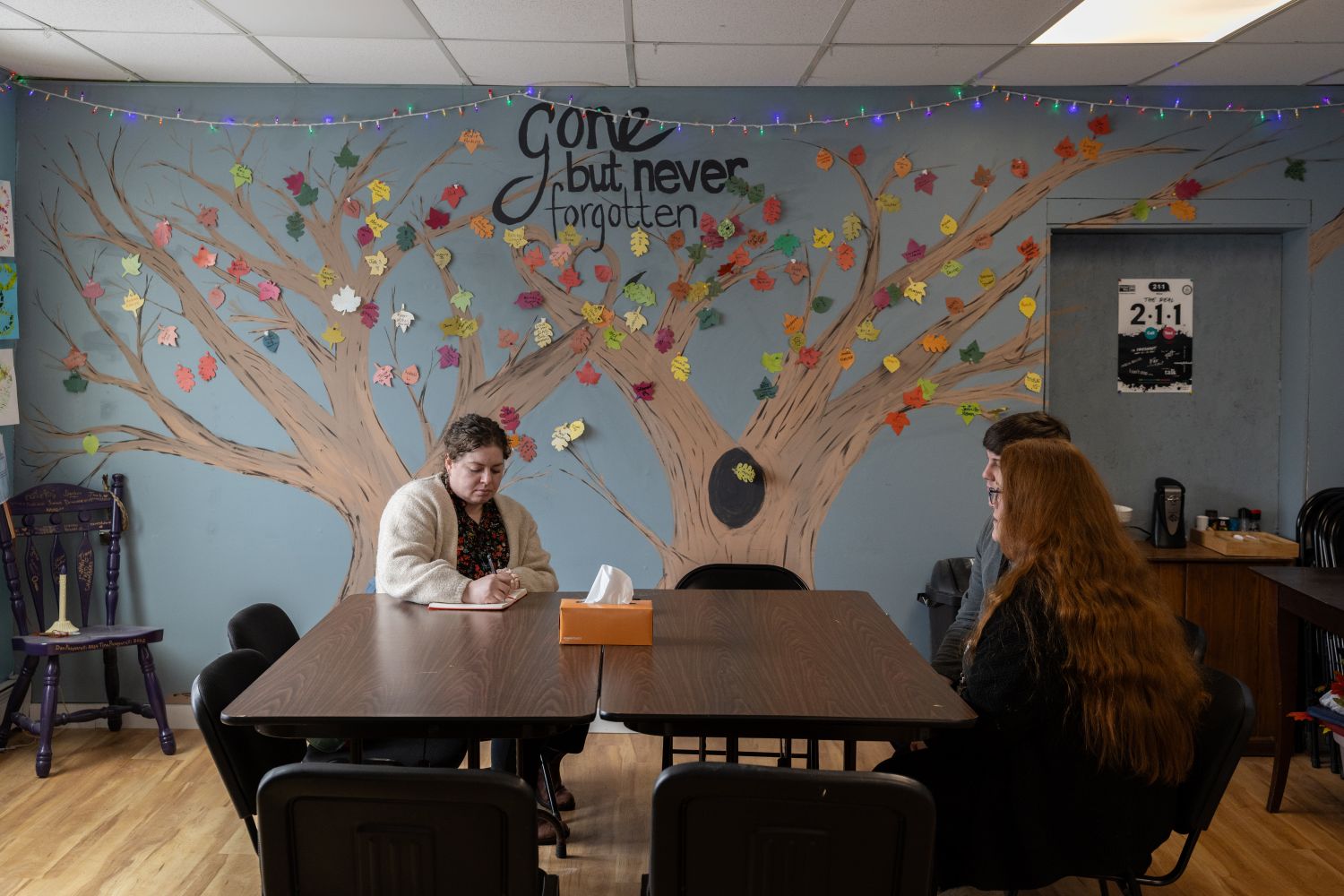 emily bader interviewing two recovery coaches while all three sit at a table