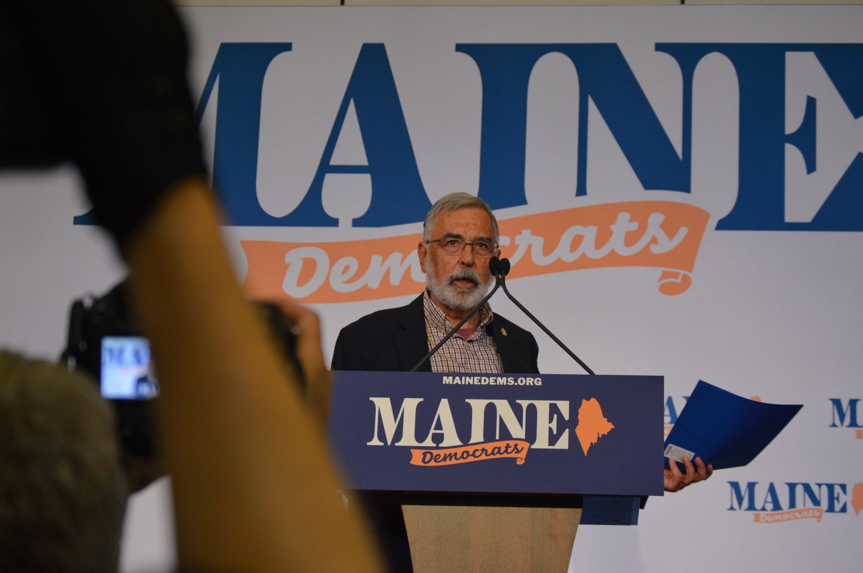 Charles Dingman stands at the podium.