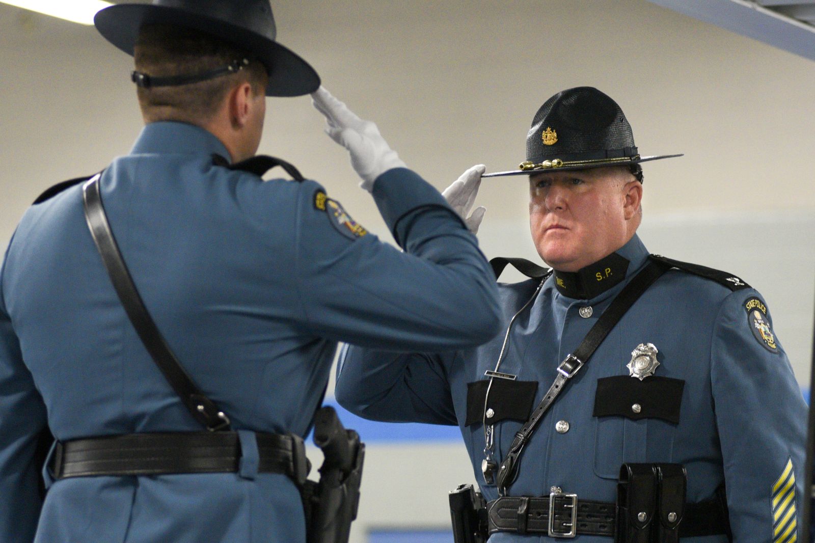 Col. William Ross salutes a new trooper