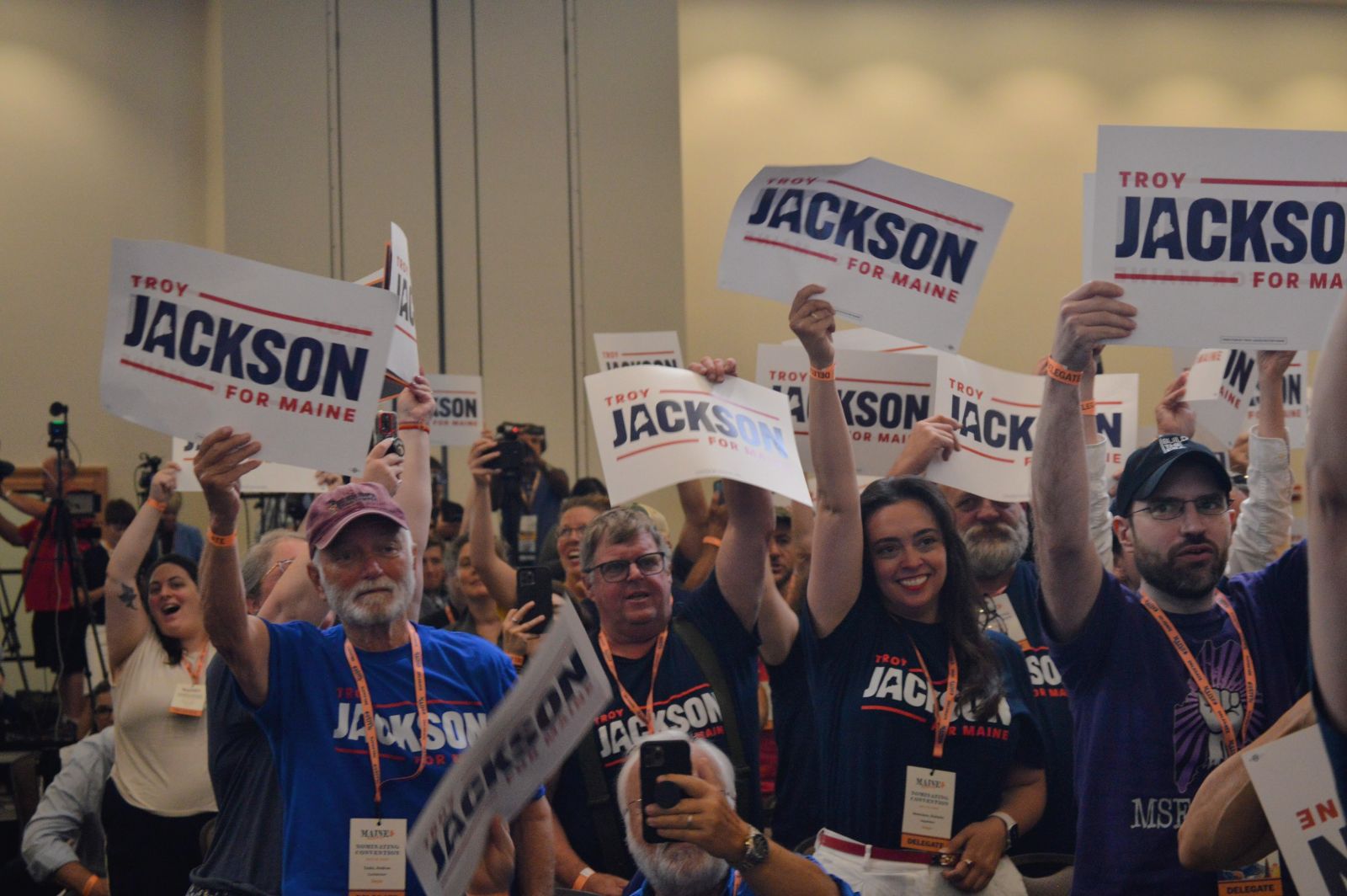troy jackson supporters cheering and holding signs